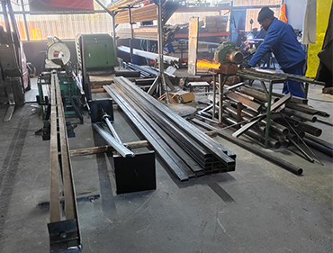 GJ Roller Doors technician cutting galvanized slats.