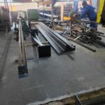 GJ Roller Doors technician cutting galvanized slats.