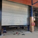 GJ Roller Doors technician maintaining shutter door.