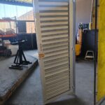GJ Roller Doors access door installed with roller shutter